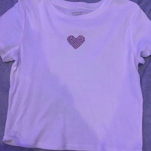 white shirt with pink heart